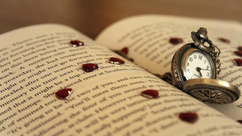 Watch and hearts on the book