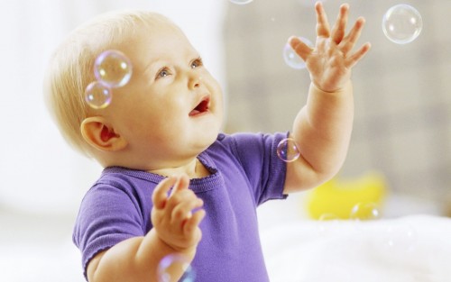 Cute baby play with water bubbles