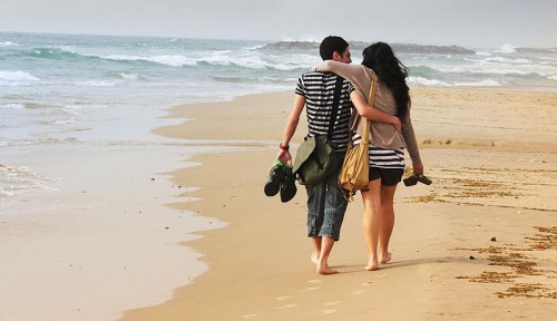 Couple Walking On Beach