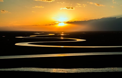 Prairie river stream curved sunset