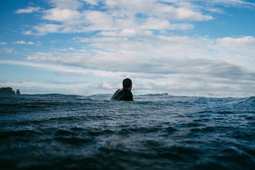 Person Floating In Ocean