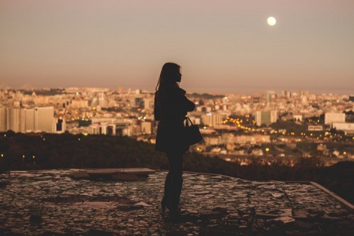 Woman Overlooking Lisbon Sunset
