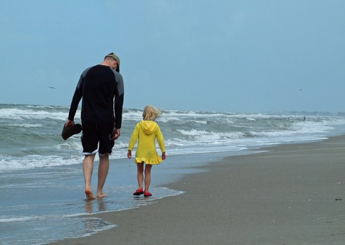 Fathers hold a special place in their daughter's hearts. A father and daughter share a few moments together as they walk on the beach. #father #daughter #beach #moments #travel