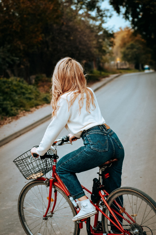 Woman riding on Red bicycle