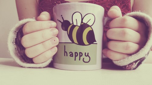 A cup with a pattern bee