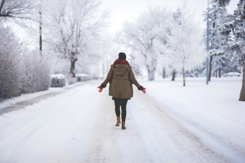 Girl Walking In Snow Path