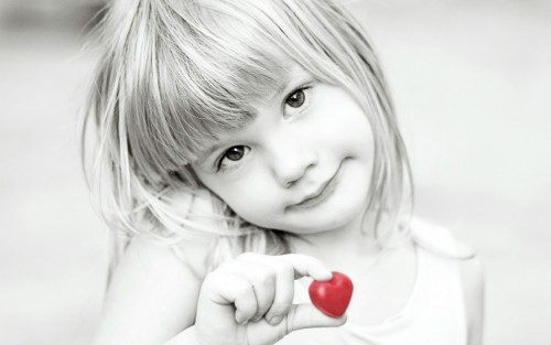 Little Baby Girl Holding Heart