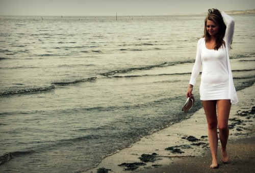 Girl walking at beach