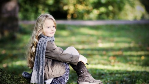 Little Girl sitting in park
